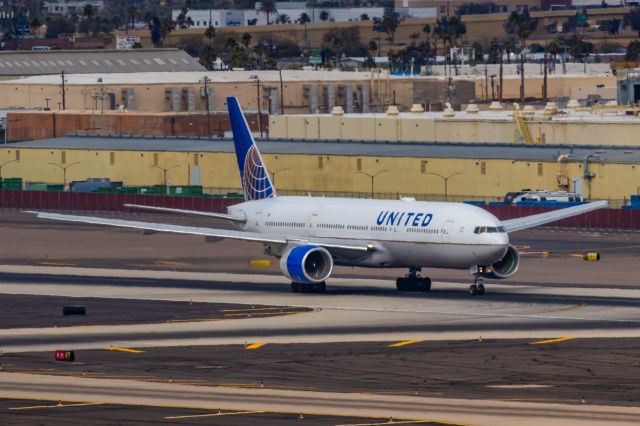 Boeing 777-200 (N768UA) - A United Airlines 777-200 taking off from PHX on 2/13/23, the busiest day in PHX history, during the Super Bowl rush. Taken with a Canon R7 and Canon EF 100-400 II L lens.