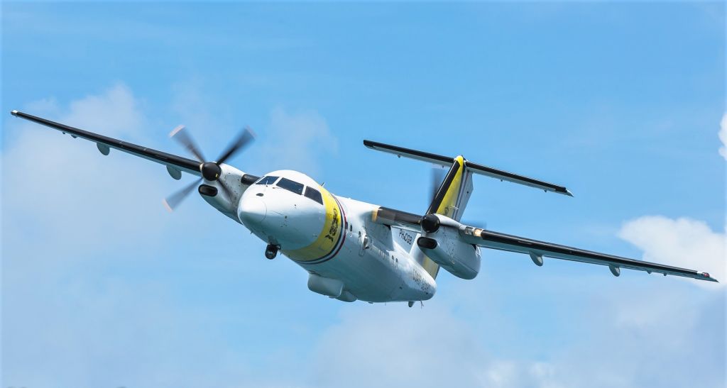 de Havilland Dash 8-100 (PH-CGB) - Coast Guard de Havilland Dash 8-100 (PH-CGB) out on patrol over the Caribbean sea.