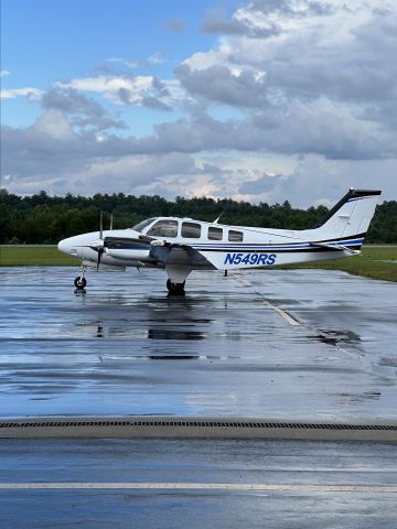 Beechcraft Baron (58) (N549RS) - Photo taken from outside terminal door