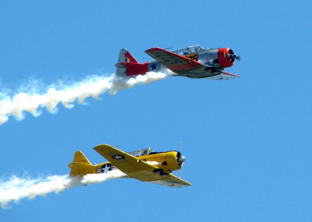 N729AM — - Two T-6 performing at Barksdale A.F.B.. N729AM is in yellow and the other aircraft in N725SD.