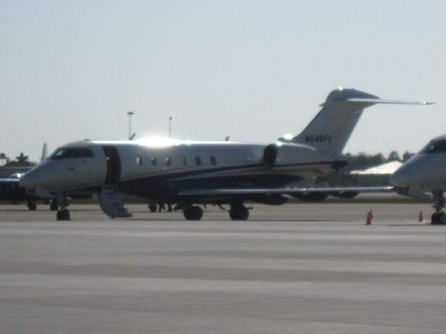 Bombardier Challenger 300 (LXJ540) - The warm sun glints off of this Challenger after its arrival from Punta Gorda, FL (KPGD).