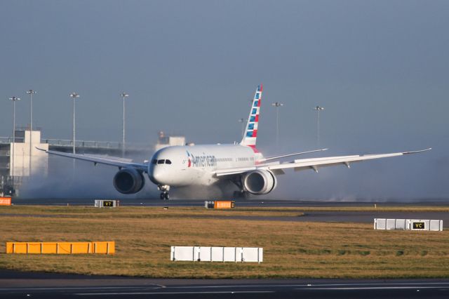 Boeing 787-8 (N809AA) - A delayed AA734 arrives from PHL and clears some water from the runway.