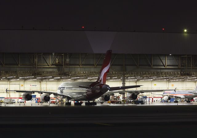 Airbus A380-800 — - Who knows what happens at night at LAX?...The kangaroo knows...Sharing the hangar for a size comparison is an American Airlines Boeing 757, N662AA. Los Angeles, California USA