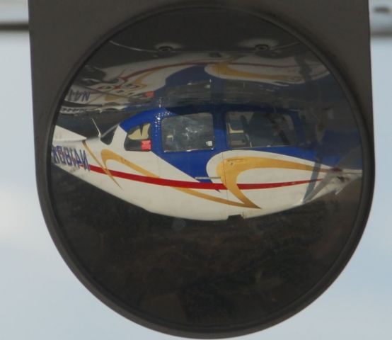 Cessna Centurion (N418DK) - Photo of the landing gear mirror while in flight.  Photo: BlakeMathis.com