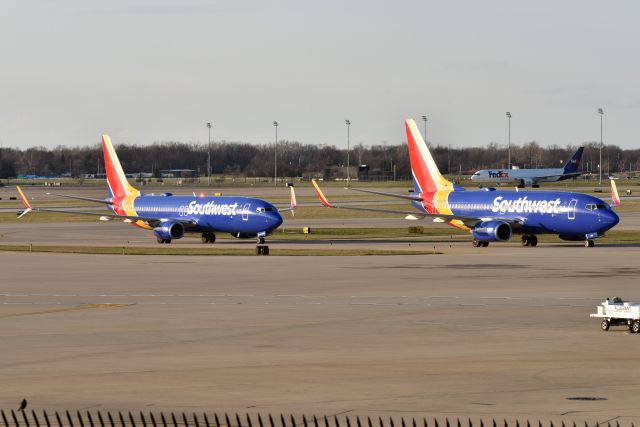 Boeing 737-800 (N8329B) - A pair of SWA MDW WX diversions sitting on the ramp. Sistership N784SW on the right, and that is FedEx 767-300F N297FE in the background on the postal ramp.