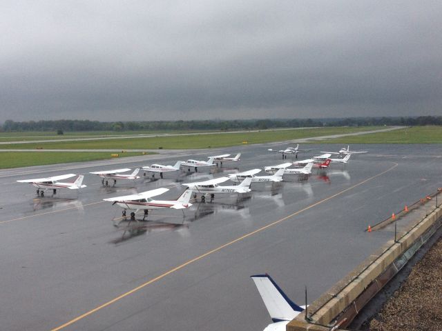 — — - The Ohio State Flight line at rest on a very cloudy day.