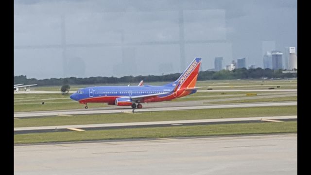 Boeing 737-700 — - Just one of the few pictures I took while waiting for our united a320 to arrive at Tampa.