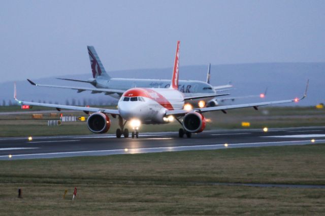 Airbus A320neo (G-UZHY) - EZY1949 with an early departure to Geneva with QTR22 A7-AEA in the background.