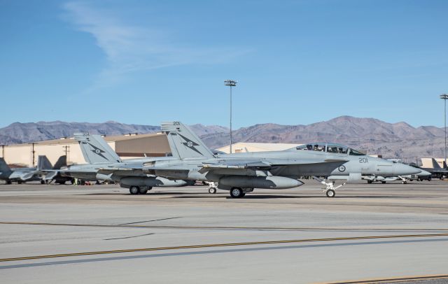 A44201 — - Two Australian Super Hornets taxiing for a Red Flag 16-1 mission.