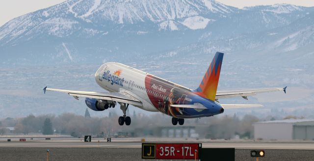 Airbus A320 (N262NV) - Allegiant's newest special livery, "Puss In Boots: The Last Wish," is seen only one week after making its debut in the skies as N262NV begins climbing away from RNO's newly-redesignated Runway 17L (*see note below) with the University of Nevada Wolfpack football team aboard enroute downstate to Las V to take on UNLV.