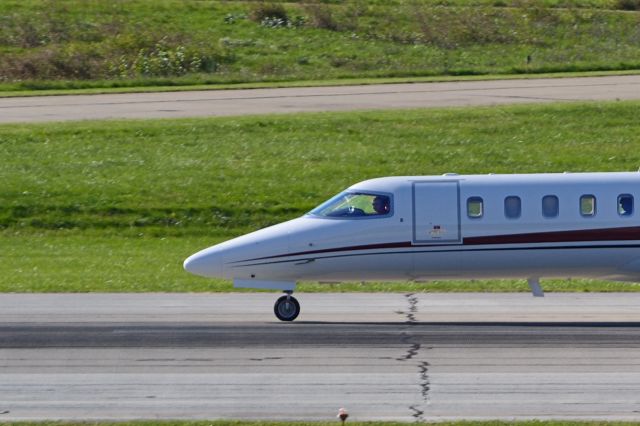 Learjet 45 (N206CK) - Pilot and passenger on Lear 45 N206CK after landing on 21L at KLUK.