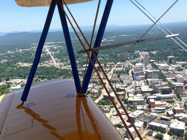 N4408N — - Flying over Downtown Greenville on a beautiful summer day in the open air! On approach to Downtown Greenville airport.