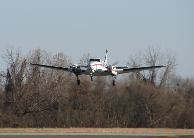 Beechcraft King Air 90 (N303CA) - Lifting off of 32 at the Downtown Shreveport airport.
