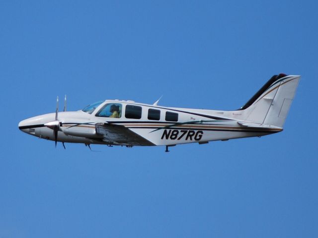 Beechcraft Baron (58) (N87RG) - Departing runway 20 - 10/3/12