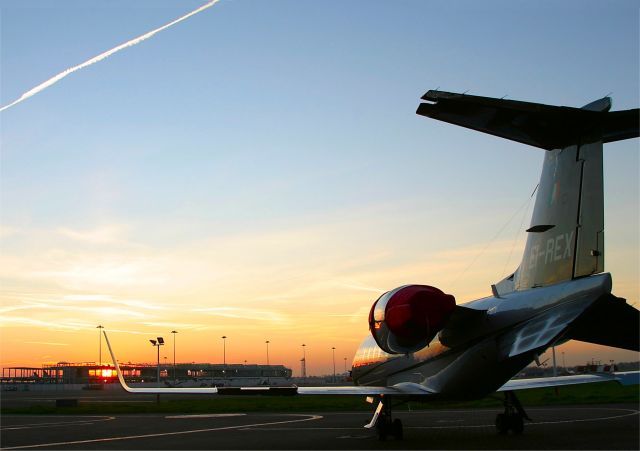 Learjet 60 (EI-REX) - Dusk at Dublin, Ireland.  This Lear Jet 60 of "Private Sky" awaits its first customer of the day at Dublin