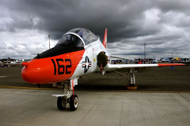 — — - July 21 2012, A T-45C Goshawk with so dark clouds in the background on display at Air Expo 2012, McChord AFB.