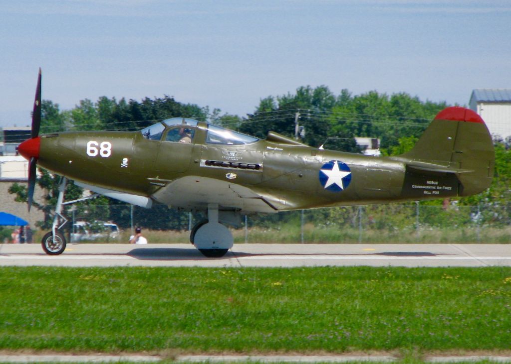 Cessna Skylane (N6968) - AirVenture 2016.     Bell P-39