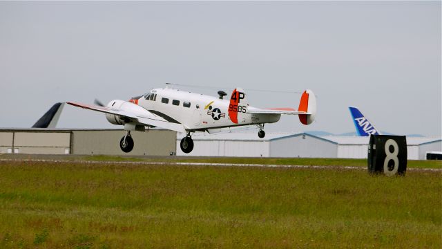 Beechcraft 18 (N585PB) - BEECH RC-45J (Ser#029585) nears touchdown on runway 34L on 6/21/12. This beautiful aircraft has now found a home at Historic Flight Foundation.