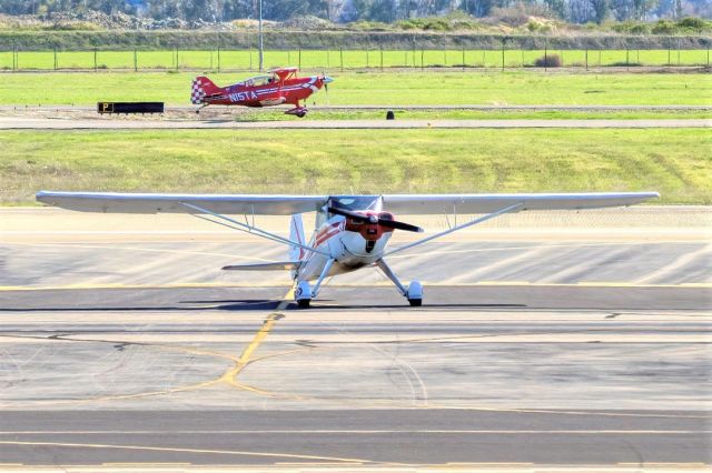 TEMCO Silvaire (N71688) - Luscombe 8A with N15TA Pitts S2C doing touch and go in the background