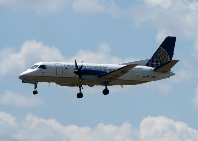 Saab 340 (N334CJ) - Colgan Air Saab landing at Shreveport Regional. Same shot, different day.