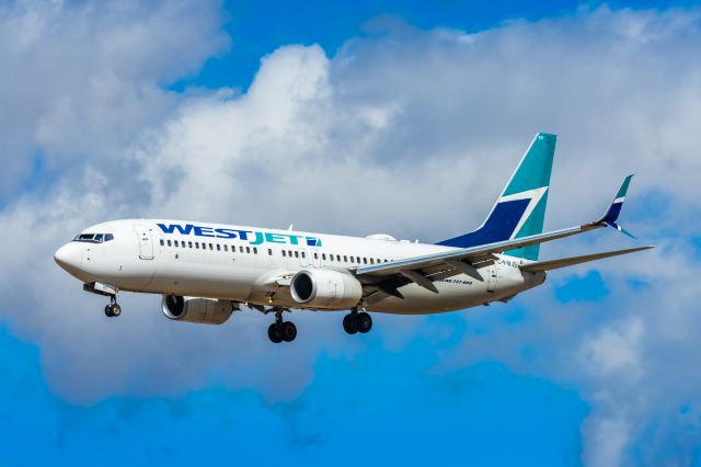 Boeing 737-800 (C-FWJS) - A WestJet 737-800 landing at PHX on 2/26/23. Taken with a Canon R7 and Tamron 70-200 G2 lens.