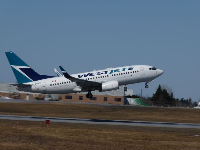 Boeing 737-700 (C-GOWJ) - taking off of RWY#07