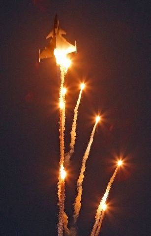 — — - SAAB Gripen dropping flares