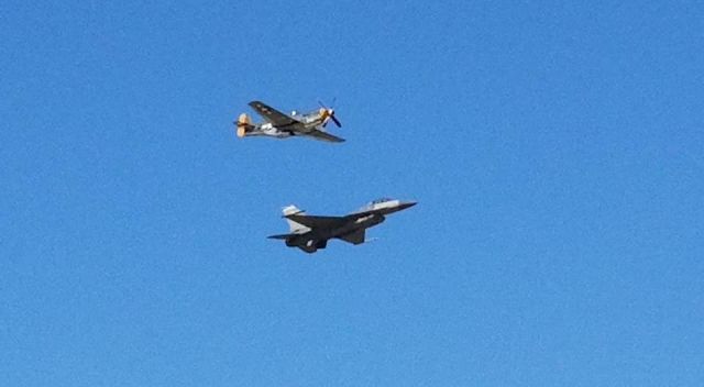 — — - Flyby of a P51 Mustang and F16