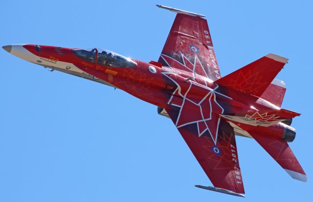 McDonnell Douglas FA-18 Hornet (18-8734) - The fabulously-schemed CF-18 Hornet (188734) of the Royal Canadian Air Force, painted to celebrate Canadas 150th Anniversary of Confederation and piloted by RCAF Capt Matthew Kutryk, screams low over my spotting position while making the final pass of the RCAF Demonstration Teams 2017 performance season.  This gorgeous CF-188 (Unit Assignment >>  4 Wing Cold Lake, C(anadian) F(orces) B(ase) Cold Lake ... CYOD*) enthralled the crowd at last weeks Aviation Roundup Airshow at KMEV.  During this pass, Capt Kutryk blistered across the sky wonderfully low, which made it possible for me to get this capture that shows every detail and title of the Red Maple special livery on the fuselage and tail of his fantastic Hornet.  And, he was so low during this last pass of the RCAF Demonstration Teams 2017 season that (if the viewer looks closely in the cockpit directly behind Capt Kutryk) it is even possible to see the white stars of the huge American flag he unfurled and waved as he taxied his warbird back to its parking spot on the KMEV ramp.br /* The RCAF announcer advised the crowd that this aircraft also uses CFB Bagotville (CYBG) as a home duty base. *