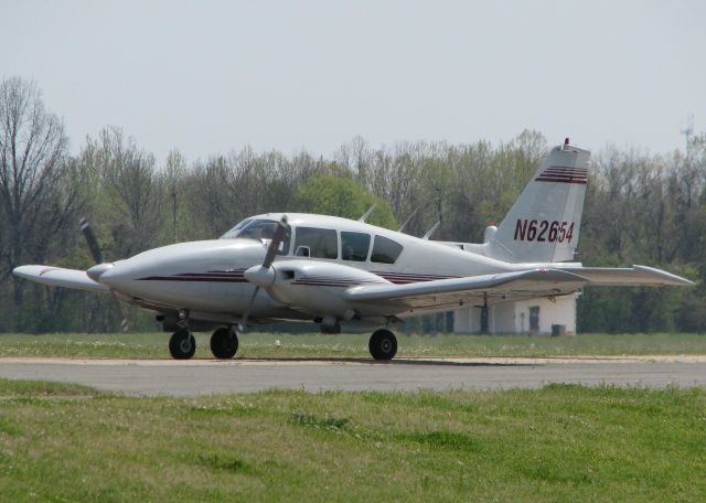 Piper Apache (N62654) - Taxiing across runway 14 after landing at the Shreveport Downtown airport.