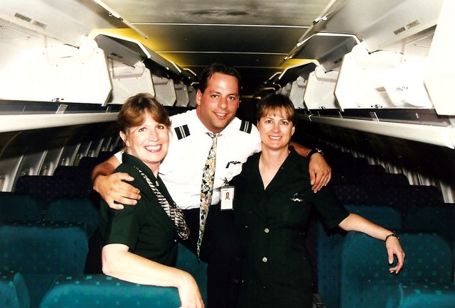 McDonnell Douglas MD-87 (N755RA) - KSJC - Last Flight Crew for RenoAir out of KSJC - Aug 31 1999 - an all white MD 87 routing SJC-RNO. I also got the Pilots and crew in one photo. The counter reps let us out to take photos of the final flight - and out on the Tarmac to get Bon Voyage Farwell photos. I sent a whole bunch of photos to a lady in Reno who was going to make a final coffee table photo book of Reno Airlines. I saw the finished product - Awesome!.