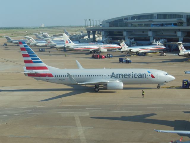 Boeing 737-800 (N816NN) - American Airlines (AA) N816NN B737-823 [cn31081]br /Dallas-Fort Worth (DFW). American Airlines flight AA1572 taxis for departure to Hartford Bradley (BDL). Terminal C in the background shows all other AA aircraft still wearing the classic bare metal livery slowly being replaced by this new white livery from 2013 following the merger with US Airways.br /Taken from the terminal.br /2014 04 22 a rel=nofollow href=http://alphayankee.smugmug.comhttps://alphayankee.smugmug.com/a