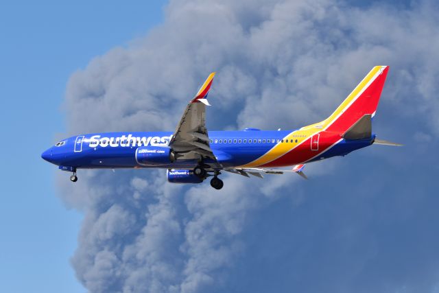 Boeing 737-800 (N8584Z) - 23-L 03-16-22. Huge 1.2 million square feet Walmart Distribution Center going up in smoke west of Airport. Smoke Plume up to 15,000, and visible on satellite imagery. Smoke-Ash cloud showed up on weather radar as intense precipitation. Cause of fire unknown. Makes for cool photo's on a sunny day. Thankfully no one injured or killed.