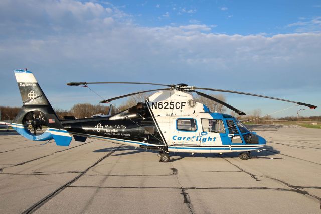 Aerospatiale Dauphin 2 (SA-365C) (N625CF) - N625CF, Care Flight- Miami Valley Hospital, just before sunset at KTOL on 22 Apr 2019.