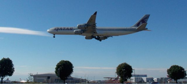 Airbus A340-600 (A7-AGB) - Next to the Runway 09R/27L