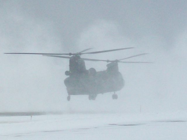 — — - Army Reserve CH-46 from Akron/Canton, Ohio clearing the snow from the runway at the Holmes County Airport in Millersburg, OH, the heart of Amish Country. He was doing training maneuvers at our airport so I decided to ask him if hed be willing to "Blow" the snow off our runway, he said "Not a problem sir!" And he proceeded to do a VERY SLOW pass down our 3500 foot runway. He took about 30 minutes and cleared it to dry pavement!