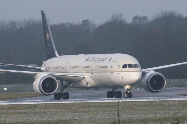 Boeing 787-9 Dreamliner (HZ-AR12) - SVA123 in the snowy haze starting to backtrack along 05L because of some taxiway repairs.