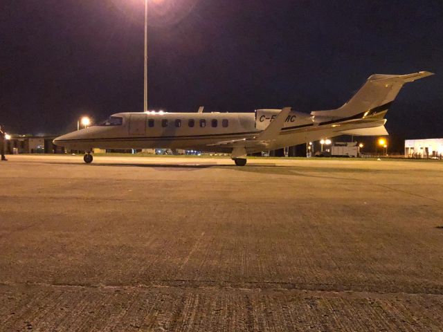 Learjet 40 (C-FEMC) - Parking on the GAT at Belfast International EGAA/BFS on a quick turn 