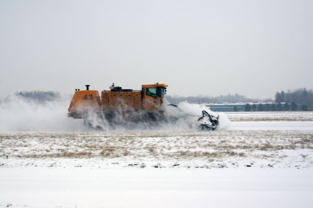 — — - Removing snow during todays snow storm