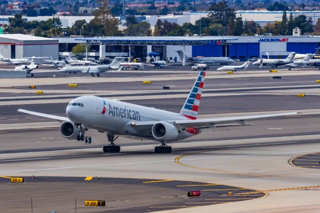 Boeing 777-200 (N779AN) - An American Airlines 777-200 taking off from PHX on 2/13/23, the busiest day in PHX history, during the Super Bowl rush. Taken with a Canon R7 and Canon EF 100-400 II L lens.