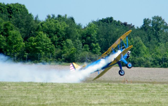 — — - John Mohr drags the wing a little during his performance at the 2012 Thunder On The Lakeshore Airshow.