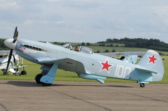 — — - YAK 3 UA taxies back to the flightline.