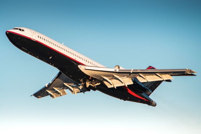 BOEING 727-200 (N727NK) - N727NK departing Hanscom for Tallahassee with the Florida State Women’s Basketball team on board a few minutes before sundown.