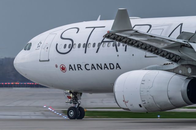 Airbus A330-300 (C-FDHG) - Taxiing to the gate before on a stormy conditions