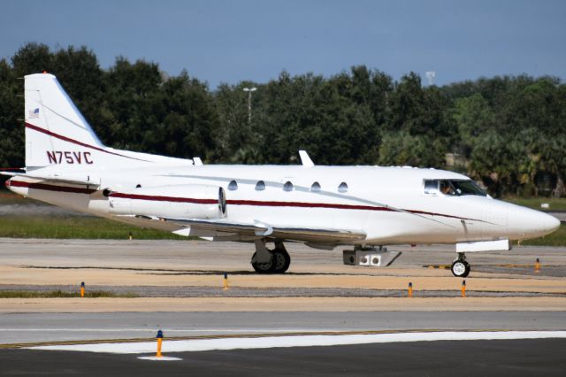 North American Sabreliner (N75VC) - 1981 Rockwell International/ North American Sabreliner 65 owned/opby Sunshine Aero Industries taxiing into Tampa International with a sensor pod attached to the belly pylon