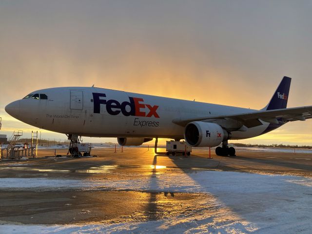 Airbus A300F4-600 (N728FD) - Airbus "Casie" seen during the golden hour of a late winter afternoon.br /br /Virga giving the sky a nice hue at sunset.  A cold late afternoon and the portable aircraft heater is running. 