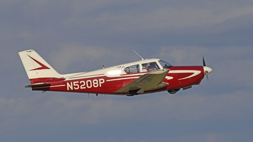 Piper PA-24 Comanche (N5208P) - Departing AirVenture on Runway 18R