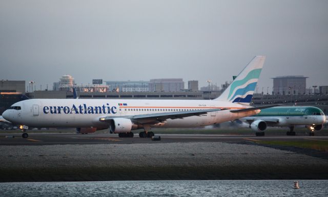 BOEING 767-300 (CS-TLO) - Operating for TACV departing Logan at sunset for Praia.