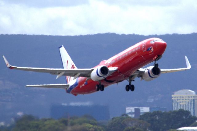 Boeing 737-800 (VH-VUK) - Getting airborne off runway 23. Friday 1st February 2013.