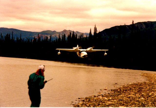 Grumman G-44 Widgeon (N575L) - North Fork of the Koyukuk River, Alaska Dropping food out the window to floaters